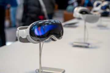 Vision Pro headset next to an architectural floor plan of a house under construction