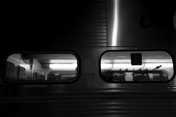 Industrial line-scan camera mounted pointing out a train window