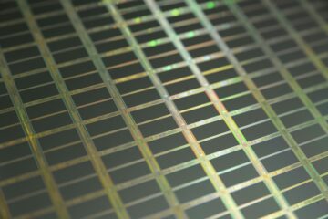 Model parallelism distributing weights across wafer-scale chips