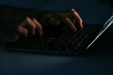 Telegram Desktop vulnerability depicted with a padlock and lines of code